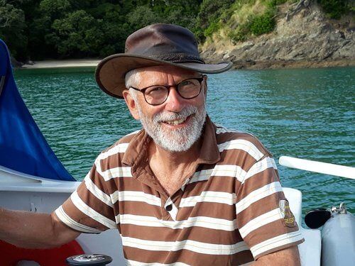 Richard Fox sailing, wearing a sun hat